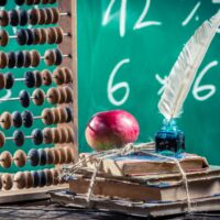 abacus, quill and old books